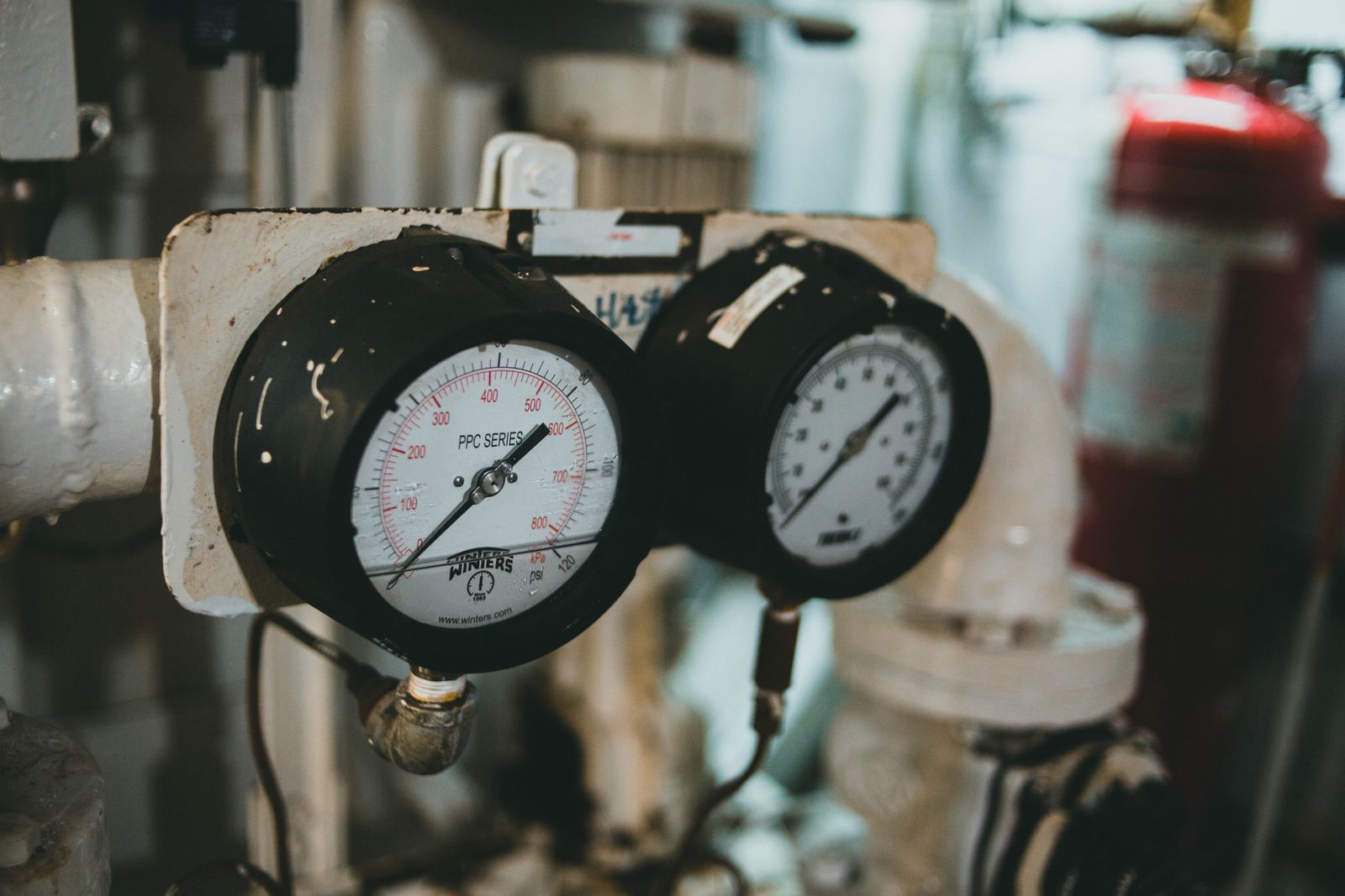 Industrial pressure gauges on plant piping
