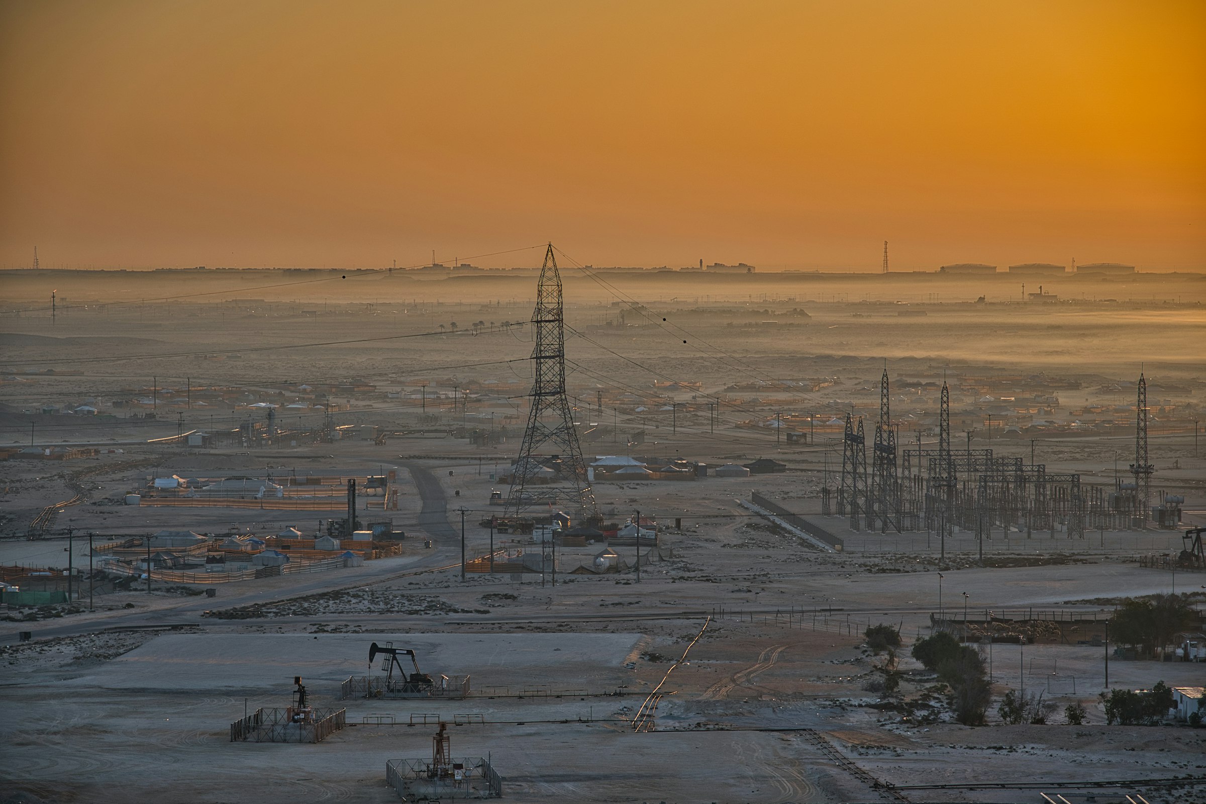 Oil and gas facility at dusk